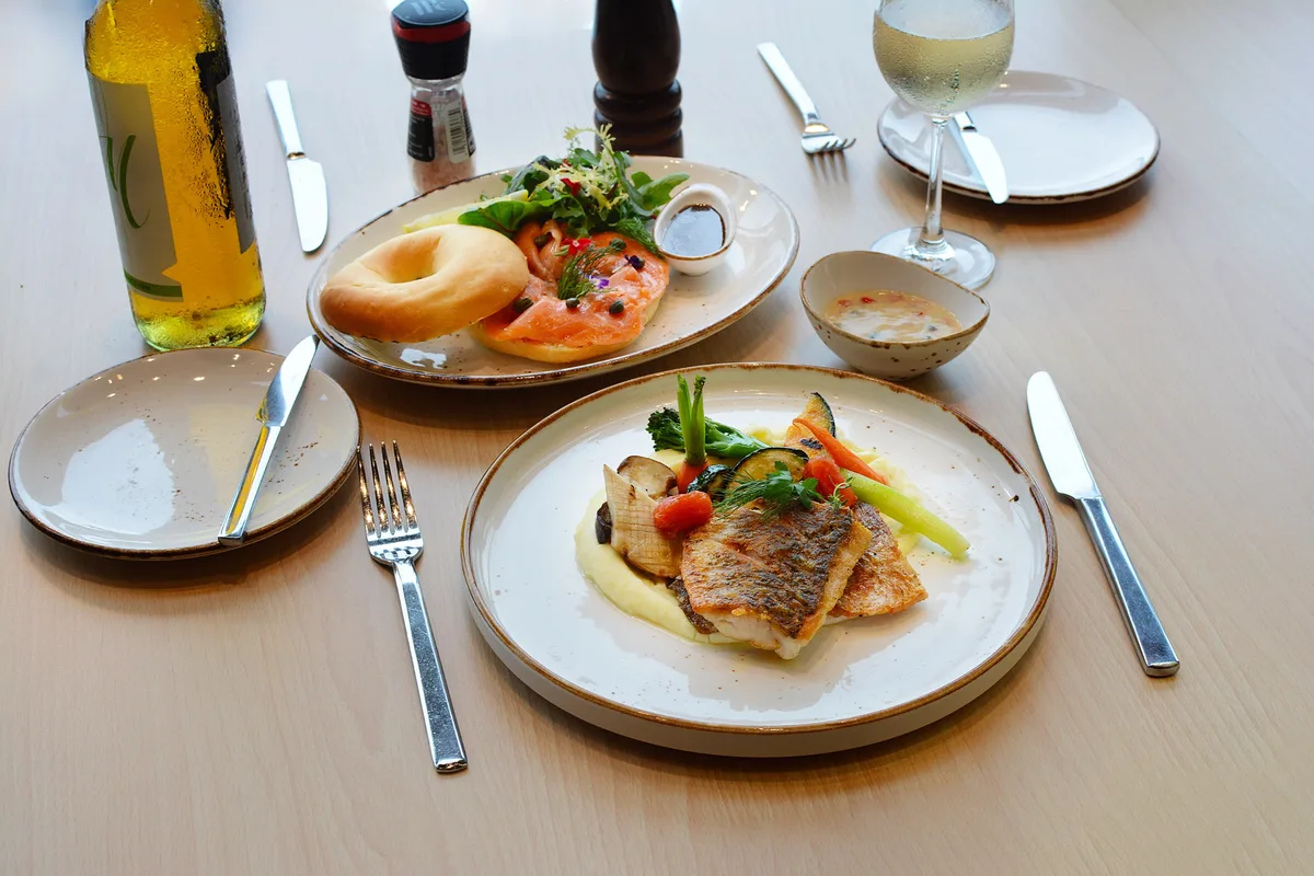Pan seared fish and smoked salmon bagel